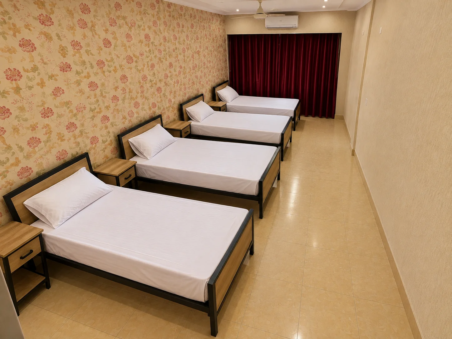 Four-seater student accommodation room with beds, chairs and wardrobes
