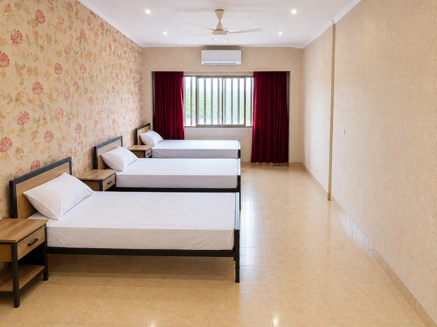 Three-seater student accommodation room with furnished beds and study desks