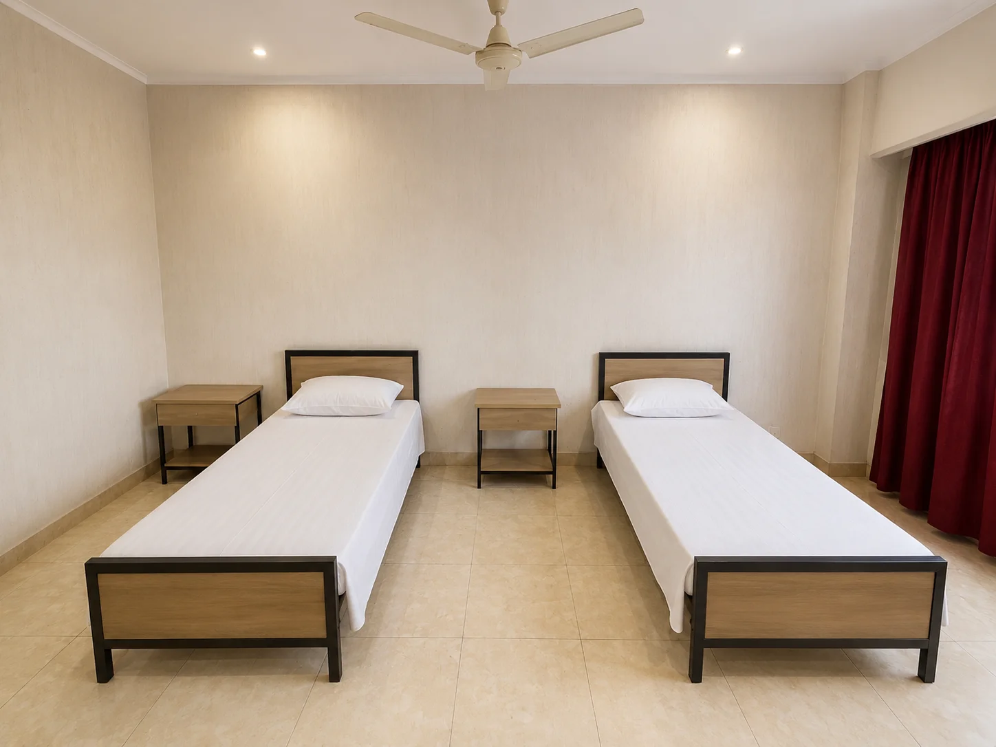 Two-seater student accommodation room with beds, desks and storage